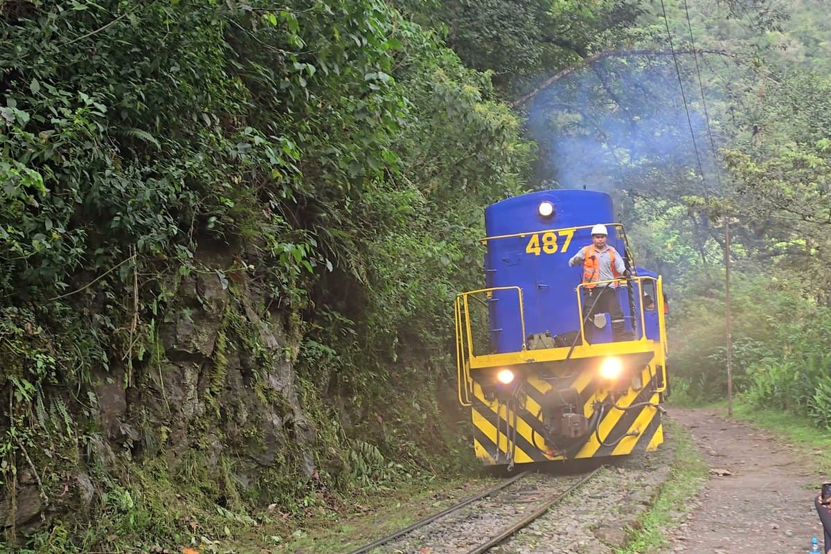 Panoramic tourist train winding through the Urubamba River gorge towards Machu Picchu and Aguas Calientes
