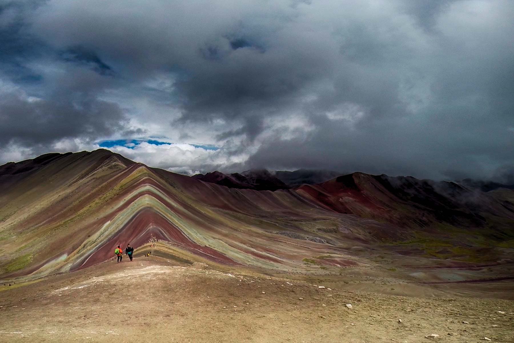 Steep colorful mineral ridges of Vinicunca Rainbow Mountain at 5,036 meters (16,522 feet) in Cusco, Peru