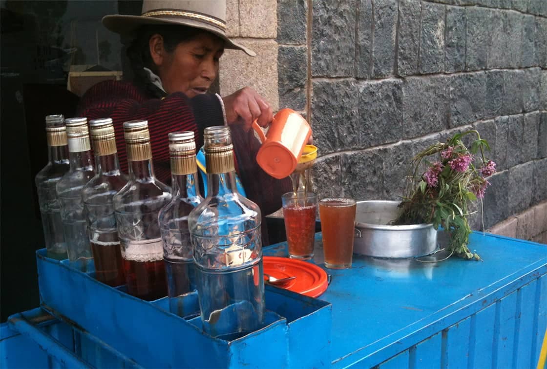 Warm Andean herbal tea tasting with local herbs in Cusco historic center