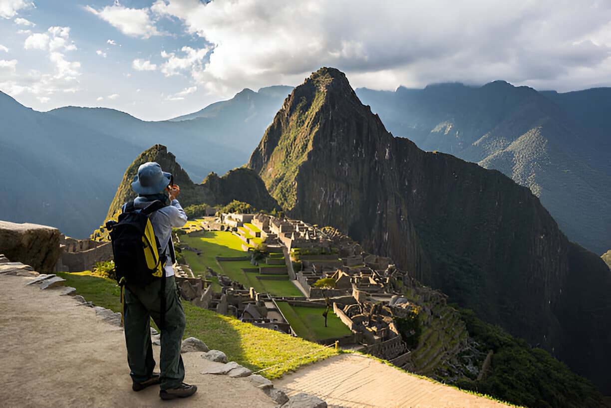 Hikers descending ancient stone Incan stairs along the Classic Inca Trail toward Machu Picchu in Cusco, Peru