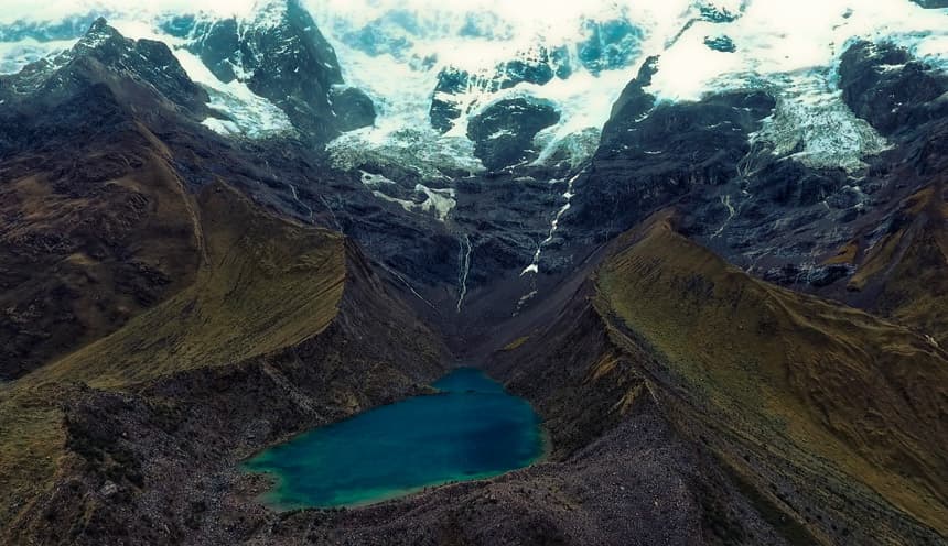 Humantay Turquoise Glacier Lake Trek - View 1 | Daspe Travel Hikers ascending the mountain trail from Soraypampa basecamp towards Humantay Lagoon