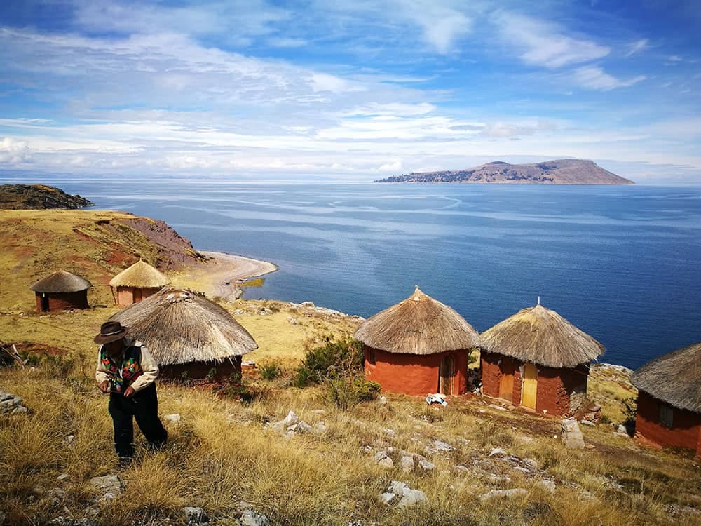 Peru Highlights Express: Lima, Cusco, Sacred Valley, Titicaca & Arequipa (8 Days) - View 2 | Daspe Travel UNESCO-recognized traditional textile weavers on the scenic island of Taquile in Lake Titicaca