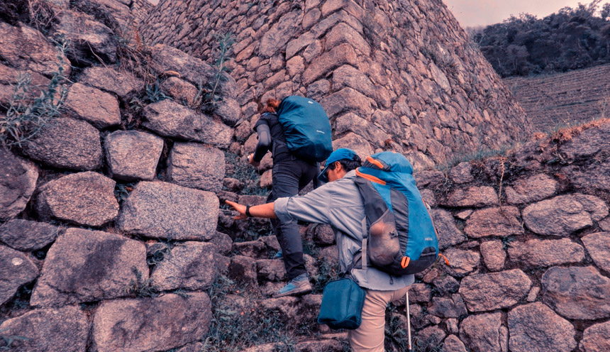 tourist climbing machu picchu